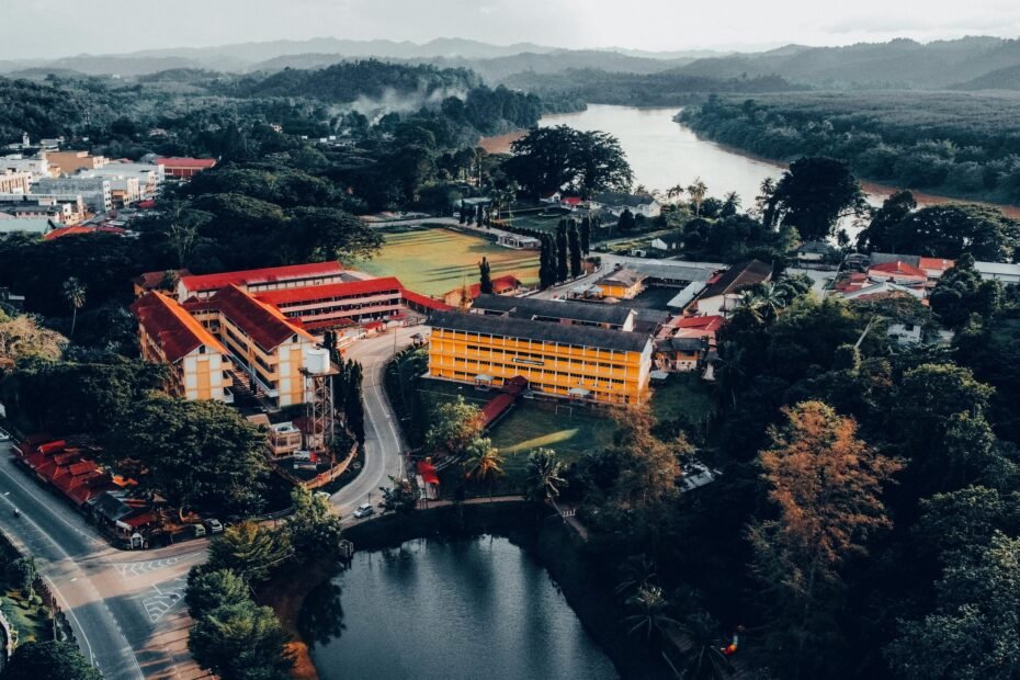 Stunning aerial view of Kuala Krai, Kelantan showcasing lush greenery and a winding river.